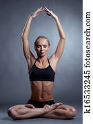 Concentrated blonde meditating in lotus position