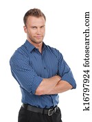 Confident man. Confident young man keeping arms crossed and smiling while standing isolated on white