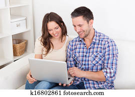 Couple Looking At Laptop