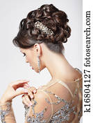 Elegance and Chic. Beautiful Brunette with Classy Hairstyle. Luxury