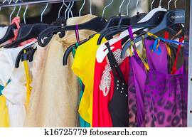 fashion clothing on hangers at the show