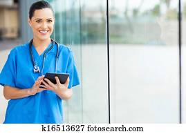 female nurse using tablet computer