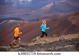 Fitness sport couple running jogging outside on trail Fitness sport couple running jogging outside on trail