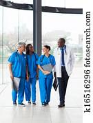 group of medical doctors walking in hospital