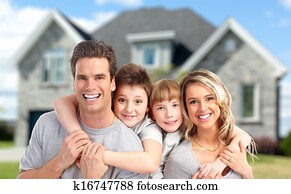 Happy family near new home.