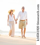 Happy senior couple on the beach. Retirement Luxury Tropical Resort