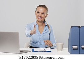 Happy young businesswoman offering handshake