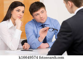 Human resources agency doing interview. Blur candidate on foreground Human resources agency doing interview. Blur candidate on foreground