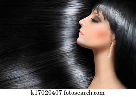 Log shiny hair of a beautiful brunette