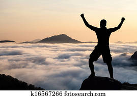 Man hiking climbing silhouette in mountains Man hiking climbing silhouette in mountains