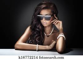 Portrait of modern young attractive brunette beauty.