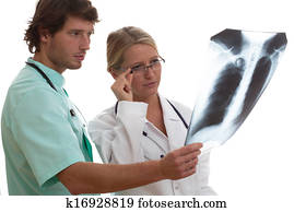 Radiologist showing x-ray to another doctor
