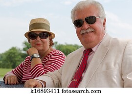 Retired Senior Couple Looking at You with their Eyeglasses Retired Senior Couple Looking at You with their Eyeglasses