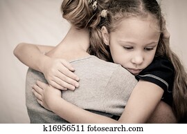 sad daughter hugging his mother
