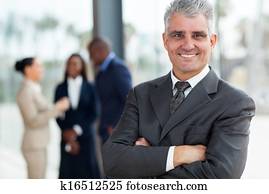 senior business executive with arms folded