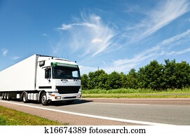 Truck driving on country road