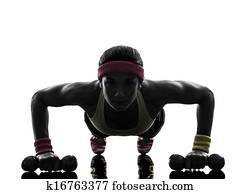 woman exercising fitness workout push ups  silhouette