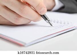 Writing in a notebook