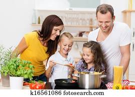 Young family cooking in the kitchen Young family cooking in the kitchen