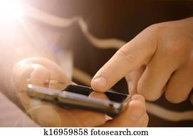 Young man using mobile smart phone