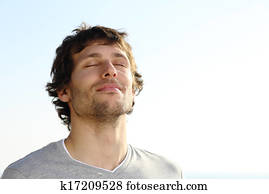 Attractive man breathing outdoor Attractive man breathing outdoor