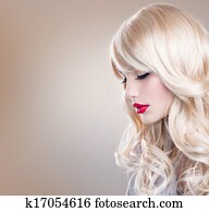 Blonde Woman Portrait. Beautiful Blond Girl with Long Wavy Hair