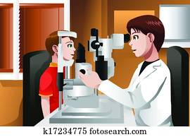 Boy having his eyes checked at the doctor office Boy having his eyes checked at the doctor office