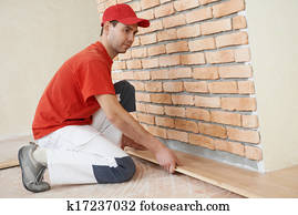 carpenter worker joining parket floor