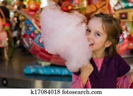 child with cotton candy child with cotton candy