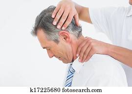 Chiropractor doing neck adjustment Chiropractor doing neck adjustment