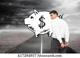 Composite image of businessman wearing handcuffs