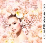 Fashion Beauty Model Girl with Flowers Hair. Bride