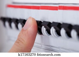Human Hand On Distribution Board