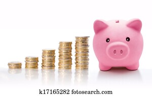 Piggy bank with euro coin stacks 