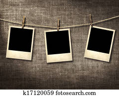 Polaroid style photographs hanging on a clothesline