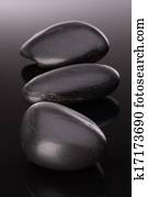 Spa stone arrangement on black surface 