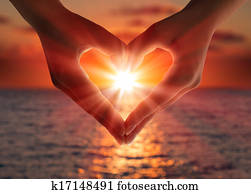 sunset in heart hands 