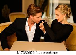 Well-dressed couple in luxury interior 