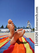 Laying down by a pool