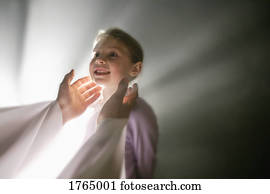 Child is welcomed into the arms of Jesus