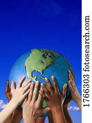 Hands touching a globe