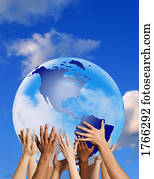 Hands touching a globe