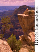Person on rocky outcrop