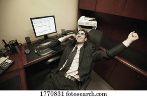Business Man in office talking on phone