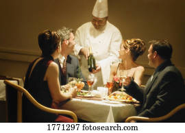 Group having dinner in restaurant