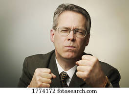 Businessman holding up fists