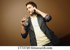 Man with water bottle and cell phone