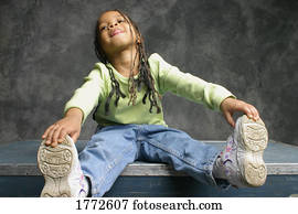 Portrait of little girl stretching