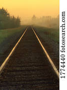 Railway track disappears in the mist