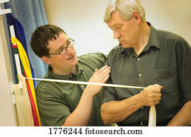 A physiotherapist working with a patient